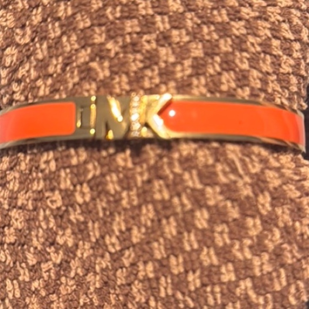 Michael Kors Orange coated steel bracelet. Clasp type closing